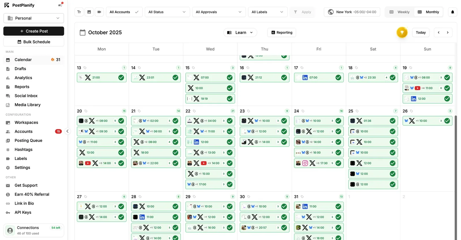 PostPlanify monthly calendar packed with multi-network posts and a sidebar for queue, reports and inbox